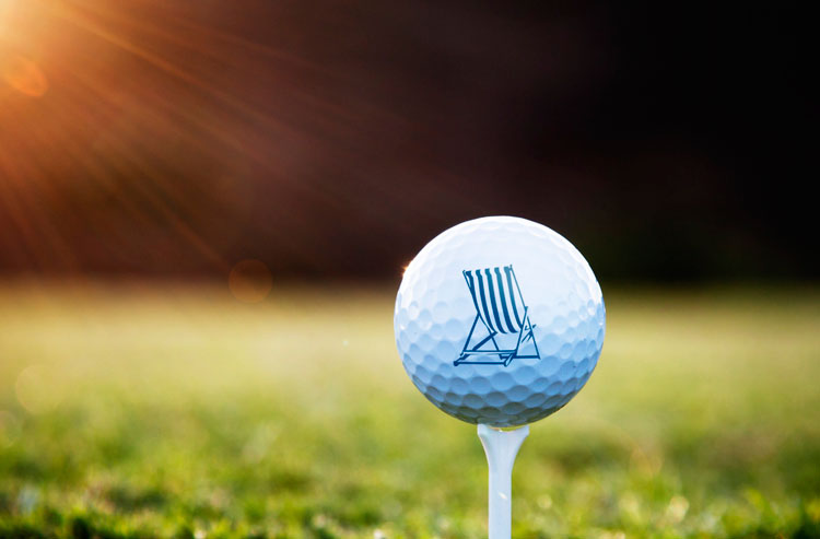 golf ball with dream resorts chair on